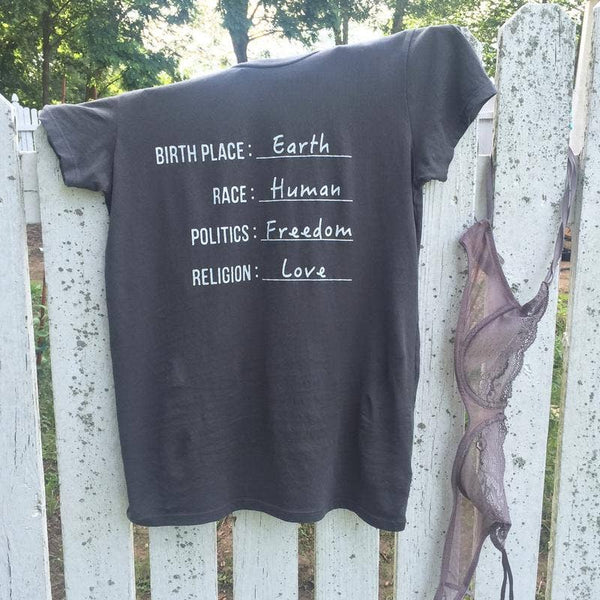 Earth, Human, Freedom, Love Organic Tshirt on fence